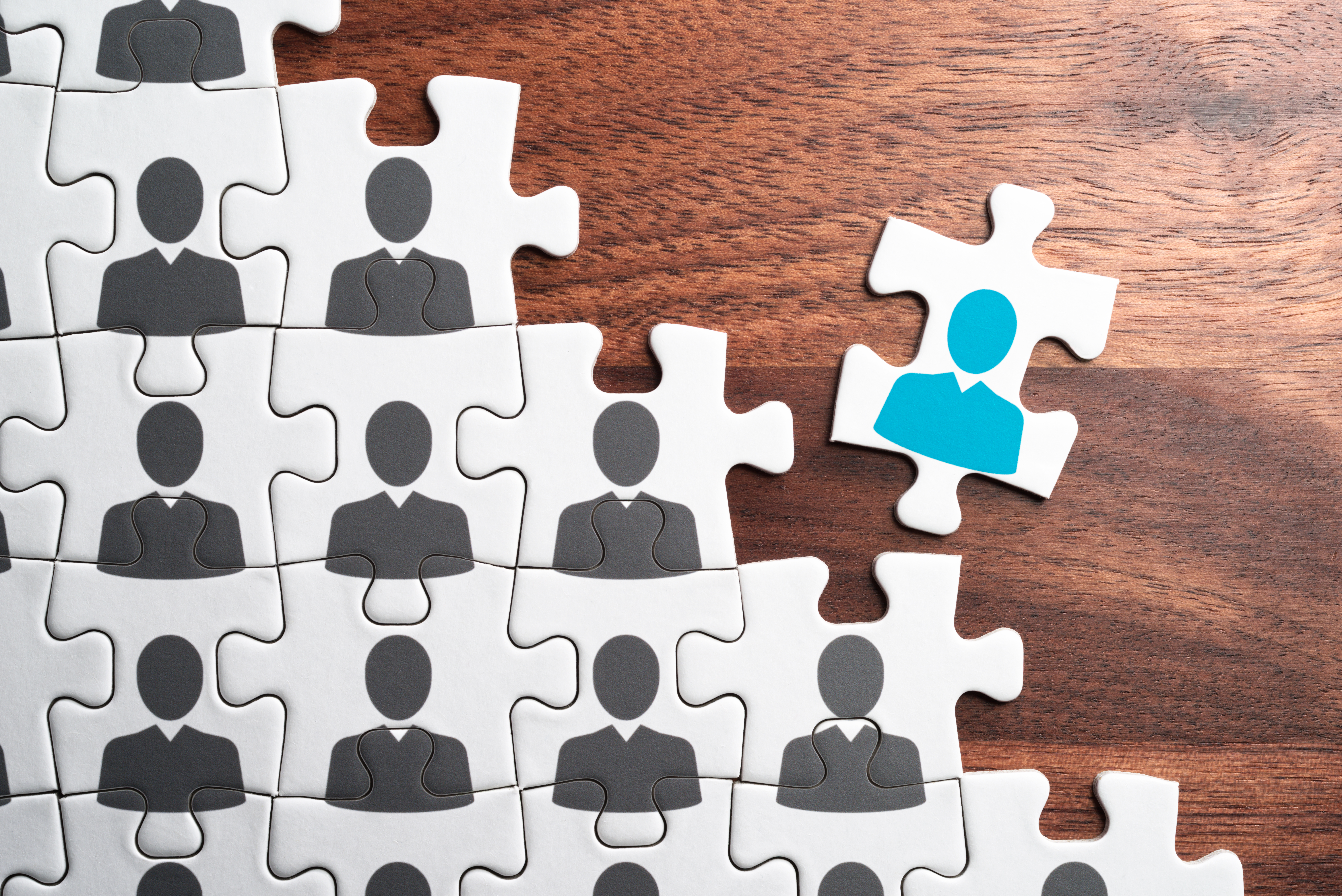 Puzzle showing people fitting together