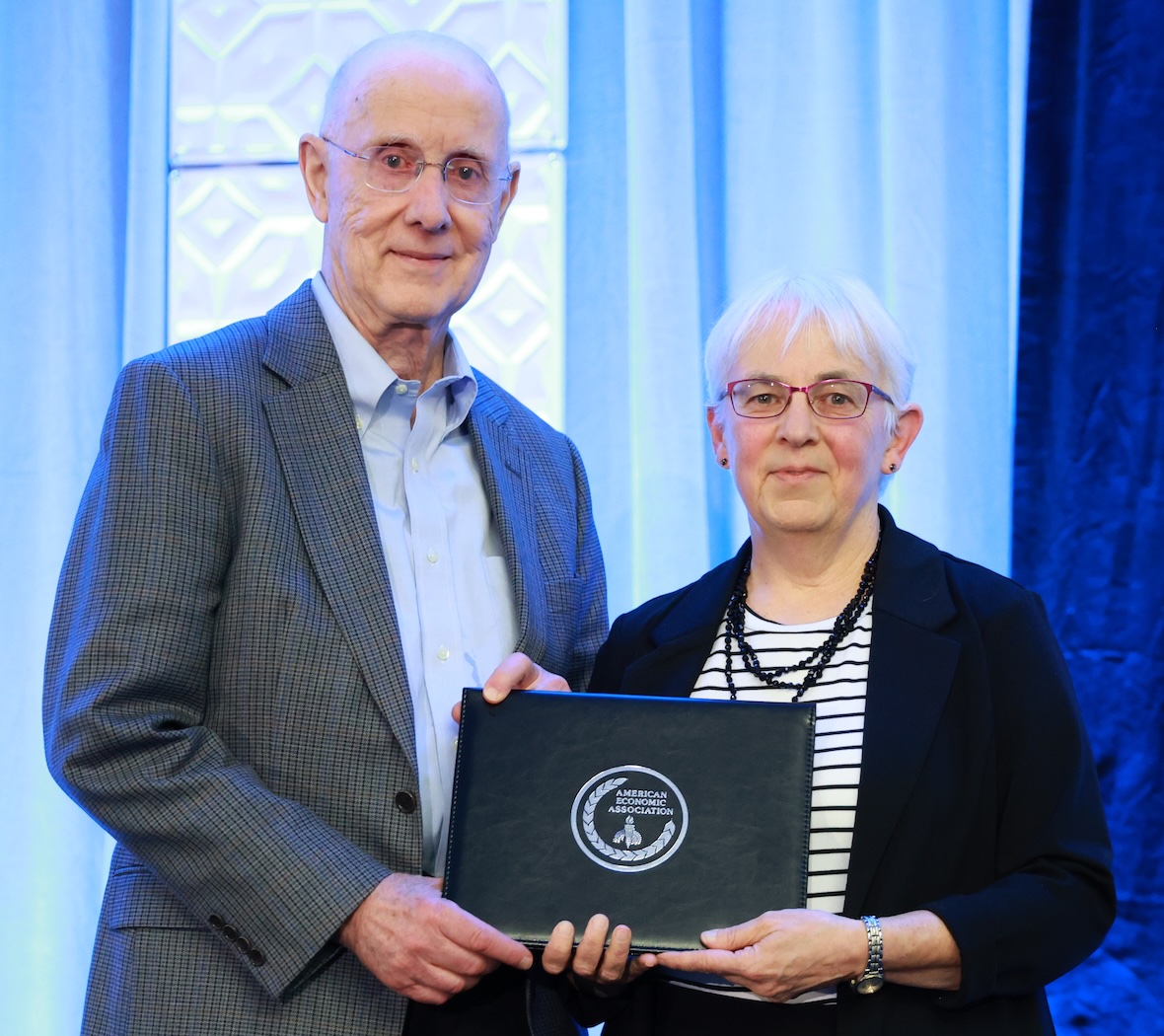 Newhouse receiving award at 2026 ASSA meeting.