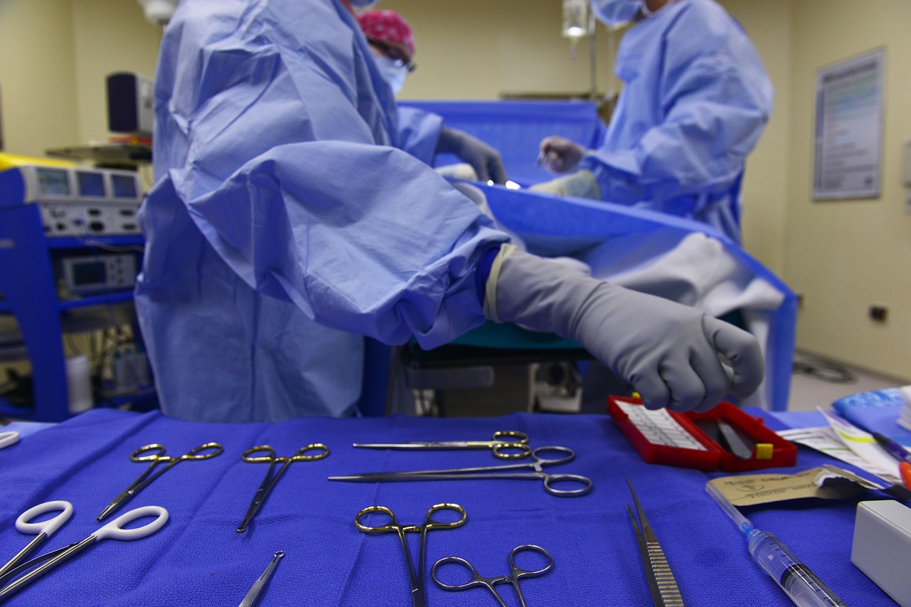 Surgeon reaching for tools