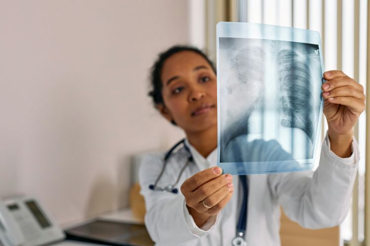 Photo by cottonbro studio: https://www.pexels.com/photo/doctor-looking-at-an-x-ray-image-of-lungs-7579819/