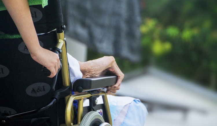 Photo of an elderly person being pushed in a wheelchair Image by truthseeker08 from Pixabay 