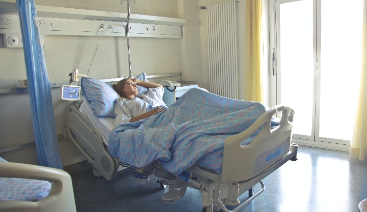 Woman in hospital bed Photo by Andrea Piacquadio from Pexels