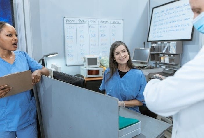 Photo by RDNE Stock project: https://www.pexels.com/photo/a-doctor-and-nurses-having-conversation-6129159/