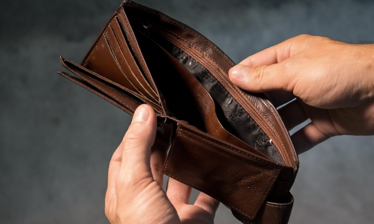 Person holding empty wallet open