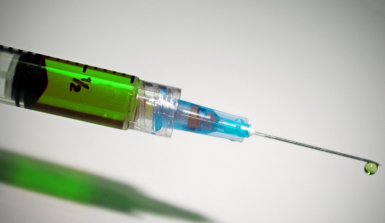 Syringe with droplet Image by Liz Masoner from Pixabay 