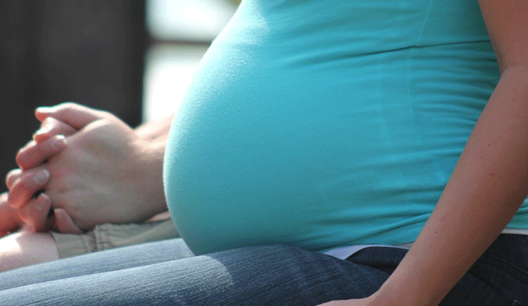 Pregnant woman sitting