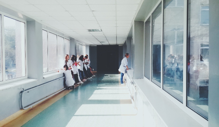 Hospital staff standing in hallway Photo by Oles kanebckuu from Pexels