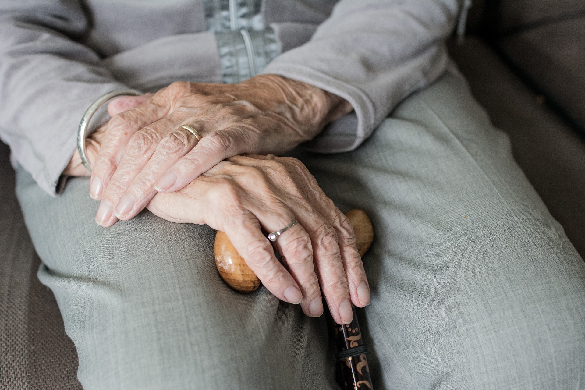 Hands of elderly woman holding cane Image by Sabine van Erp from Pixabay
